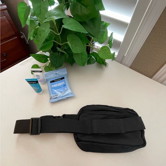 Neutrogena Belt Bag, 1-Lrg Zip Pocket , 1-Smaller Zip Pocket with products. - Picture 3 of 9